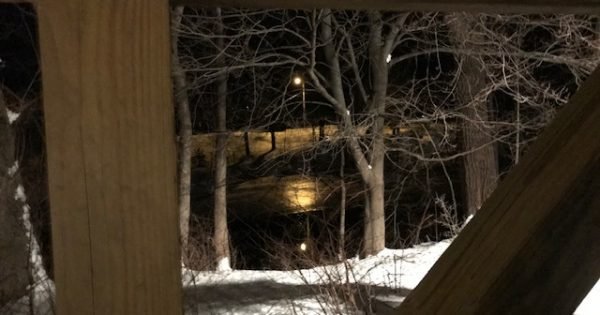 Nighttime pond, wooden beams