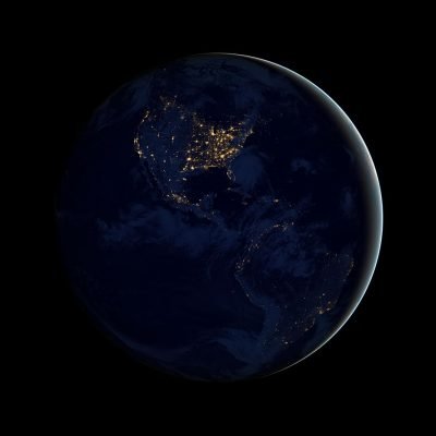 A dark picture of the earth. There's a sliver of an outline to the right and the US can be see with lights on