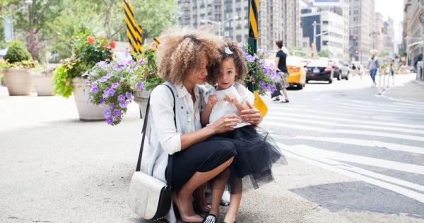 Mom and daughter in street of New York