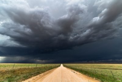 Storm clouds, dirt road