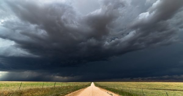Storm clouds, dirt road