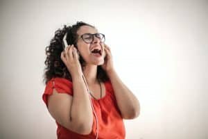 woman with headphones singing