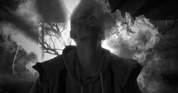 Ghost man smoking a cigarette.