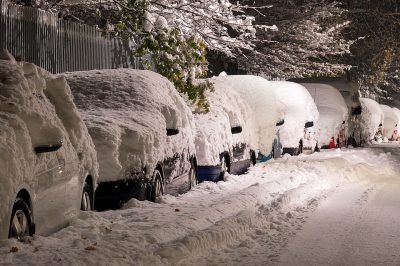 Snow covered vehicles