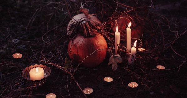 pumpkin with candles around it