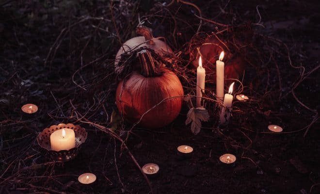 pumpkin with candles around it