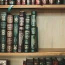classic leather books on a shelf