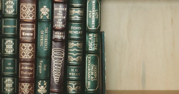 classic leather books on a shelf