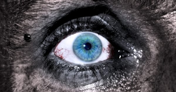 Image of a young woman's blue eye with dirt on her skin by Adrian courtesy of Pixabay is the cover image for Scarlett Faye's young adult serial story about Micki, a teenager fighting for survival after being in a gruesome wreck with her mother.