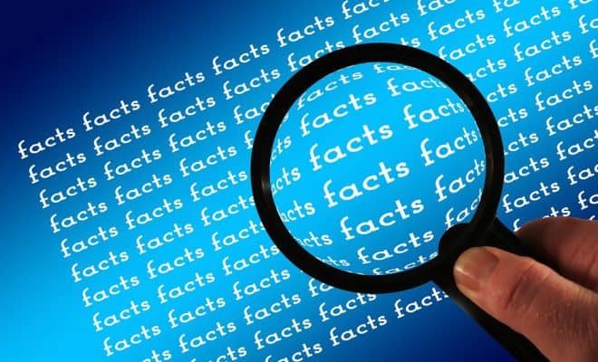 magnifying glass over the word facts