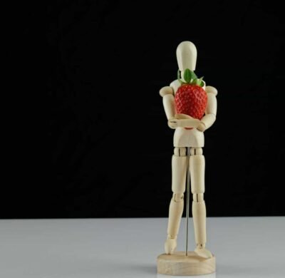 figure for posing holding strawberry