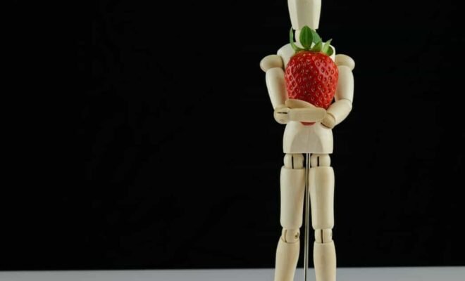 figure for posing holding strawberry