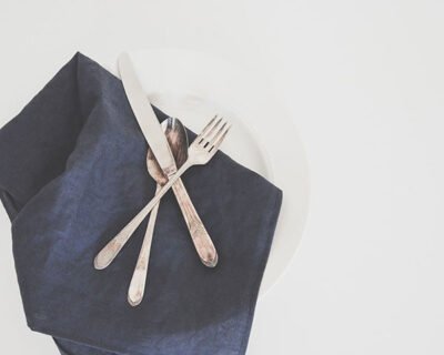 A place setting with the fork and knife crossed