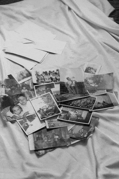 photo of scattered black and white photographs