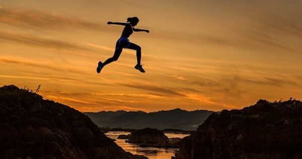 Girl jumping mountains