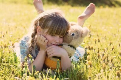 Girl embracing a teddy bear