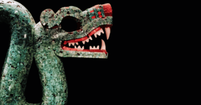 an image of a green dragon serpent made of mosaic stones with sharp teeth