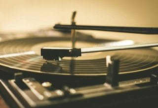 record play with a vinyl record on the turn table