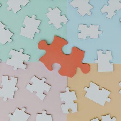 white puzzle on colored background