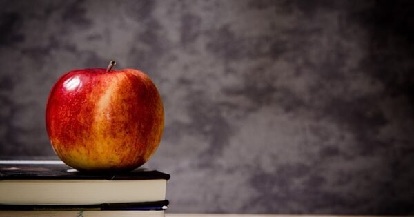 Apple upon a set of books