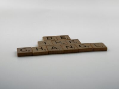 be the change spelled out in brown blocks with black letters