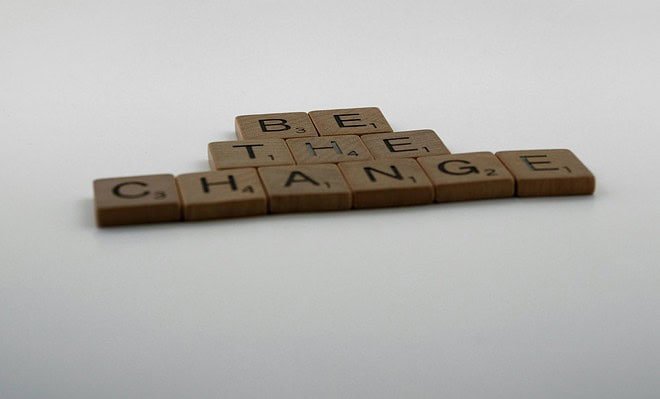 be the change spelled out in brown blocks with black letters