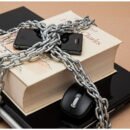 A book and laptop chained together