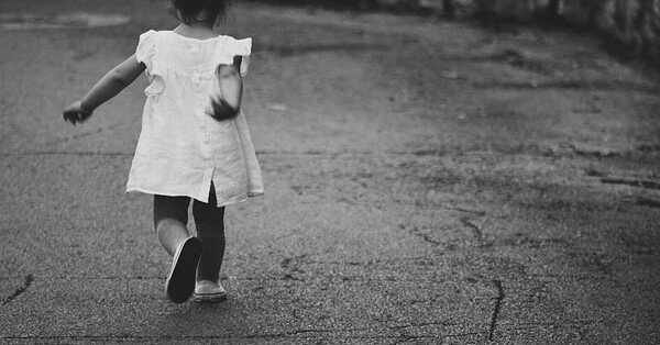 an image showing a toddler walking