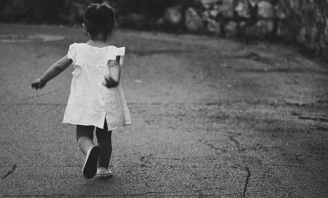 an image showing a toddler walking