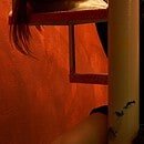 Woman in black dress sleeping on stairs.