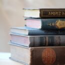 books stacked on top of the other