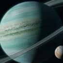 A planet banded by swirling blue and white clouds is encircled by a vast ring system and orbited by a small, golden moon