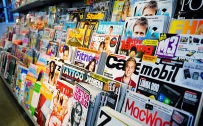an assortment of magazines on display