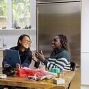 two ladies having a cheerful conversation