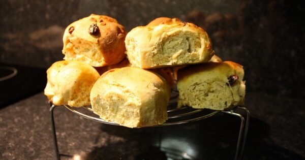 A plate of freshly baked, hot cross buns