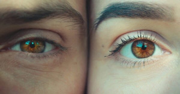 A man's left eye and a woman's right eye side by side.