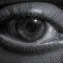 Close up black and white photo of eye