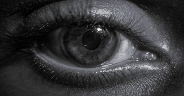 Close up black and white photo of eye