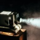 vintage projector in a smokey room