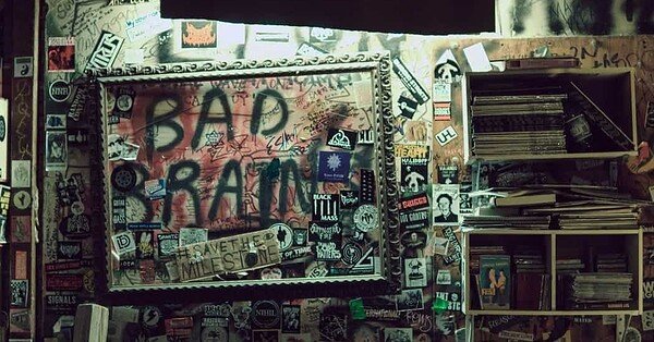 a photograph of a dilapidated and creative room with graffiti on the walls