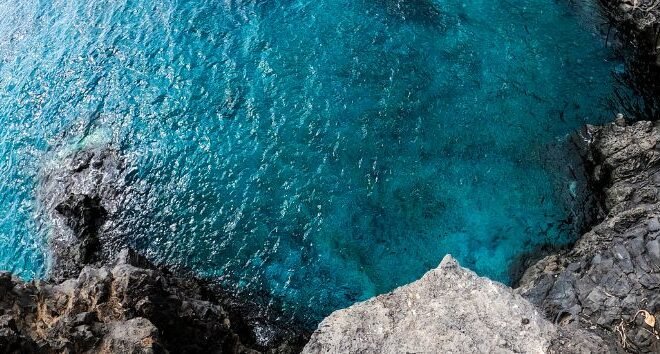 Cliff overlooking body of water
