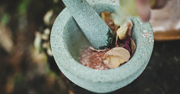 a mortar and pestle with spices inside