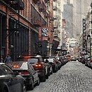 A street lined with cars in NYC
