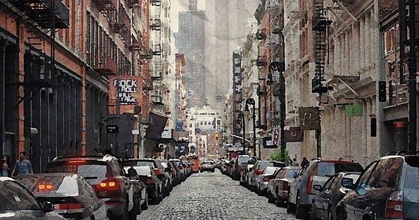 A street lined with cars in NYC