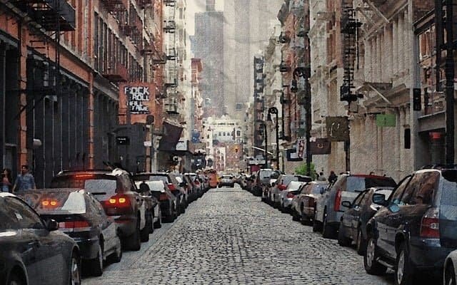A street lined with cars in NYC
