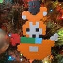 A handmade fox melty bead ornament turns out misshapen when the artist has trouble following the pattern.