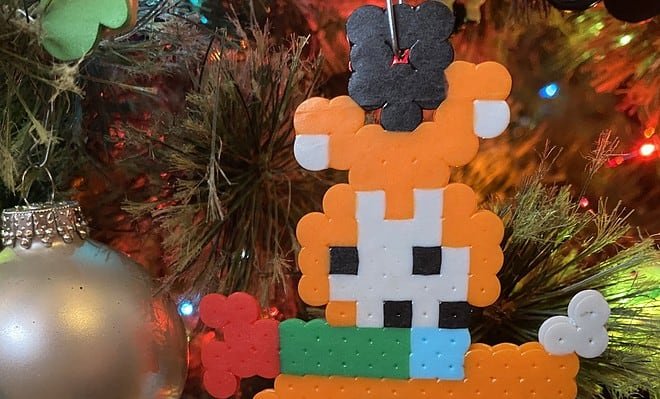 A handmade fox melty bead ornament turns out misshapen when the artist has trouble following the pattern.