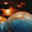 A low lit picture of a globe.