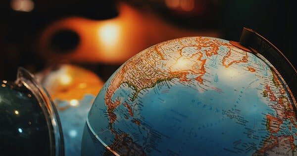 A low lit picture of a globe.