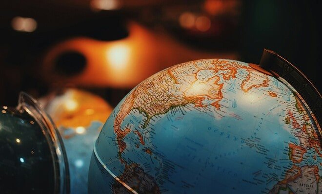 A low lit picture of a globe.